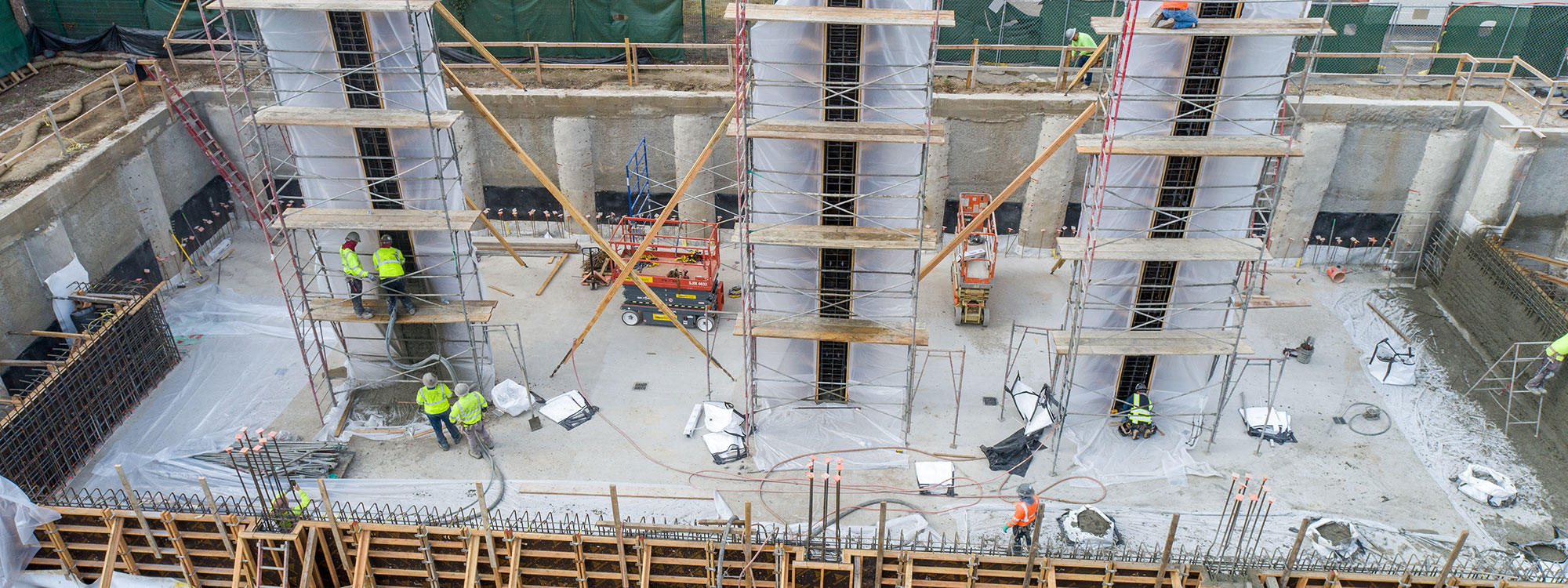 San Luis Square, San Luis Obispo, CA Builder - Design and Build Contractors - Multi-story Mixed Use Building Construction - Condos - Condominium Construction - Retail Shopping Center - Underground Parking - Structural Steel and Wood Framing Construction - JW Design & Construction